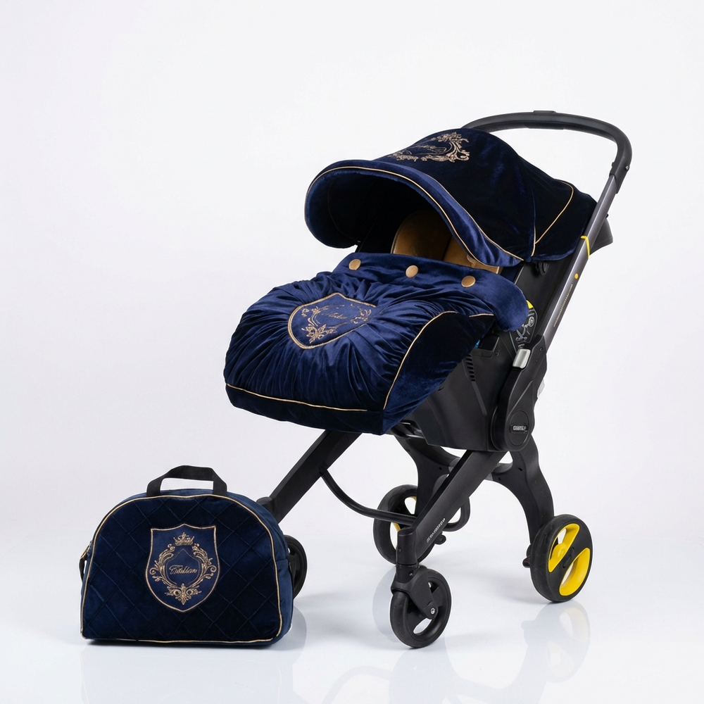 Navy blue baby stroller with matching bag on a white background