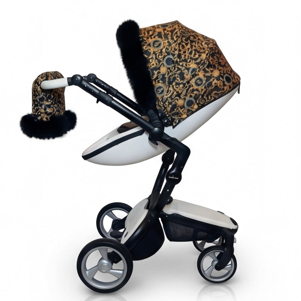 Full side view of a luxury patterned stroller cover set featuring a canopy and stroller mittens with natural arctic fur trim, displayed on a white background.