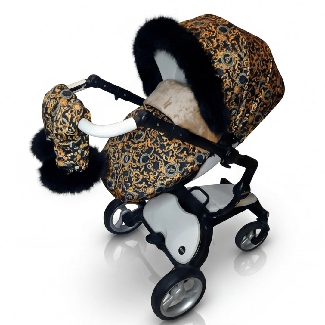 Luxury stroller cover set with ornate patterned canopy, inner fur lining and matching stroller mittens with natural arctic fur trim, shown on a white background.