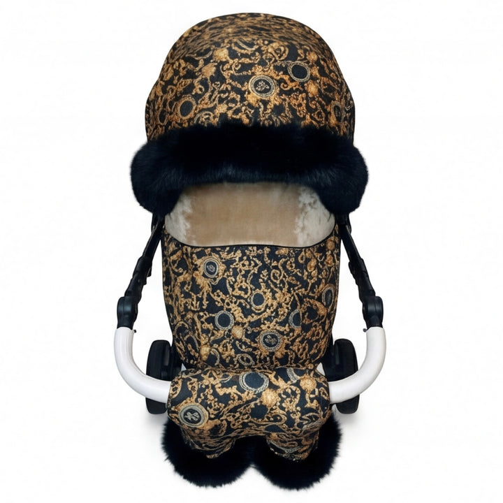 Front view of a luxury patterned stroller cover set with fur-lined canopy and matching stroller mittens trimmed with natural arctic fur.
