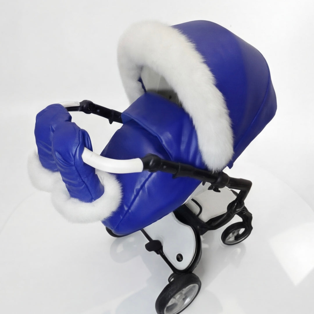 Side view of a blue stroller cover set with quilted canopy, white arctic fox fur trim, matching footmuff, and mittens, displayed on a stroller frame against a white background.