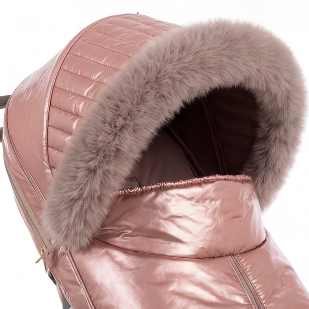 Close-up of a rose gold metallic stroller cover with quilted canopy and beige faux fur trim, shown against a white background.