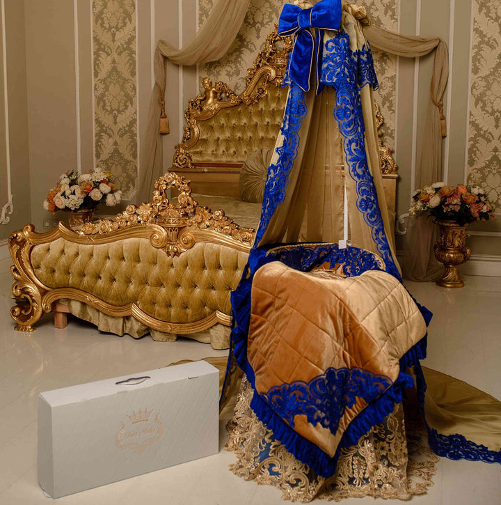 Handmade decorative baby cradle design with velvet fabric, gold-toned details, and custom luxury nursery styling.