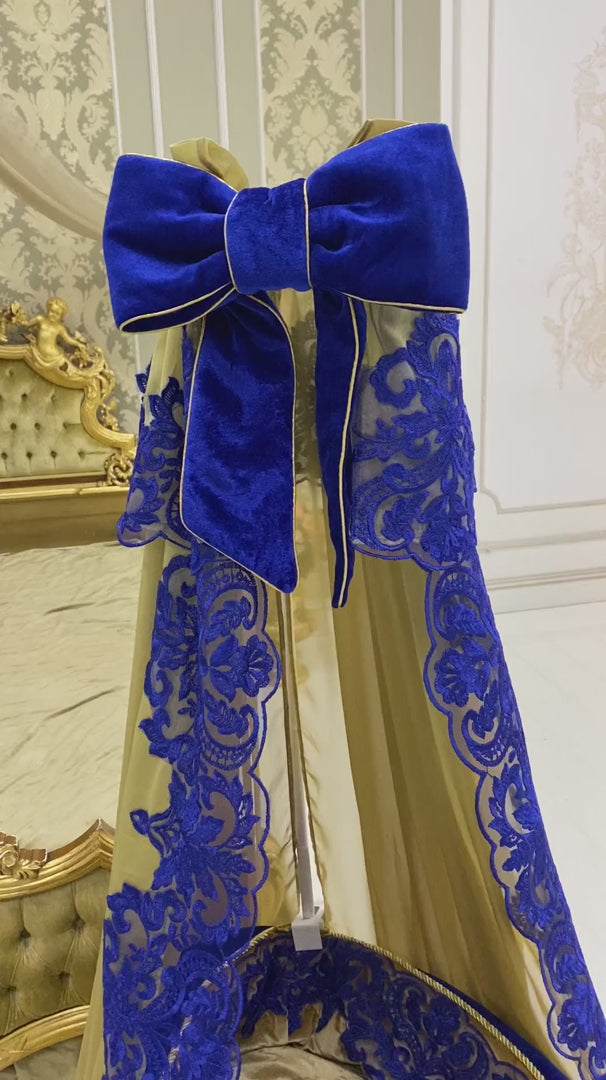 Video showcasing luxury royal blue and gold nursery decor set with decorative baby textiles, handcrafted details, and premium design accents.