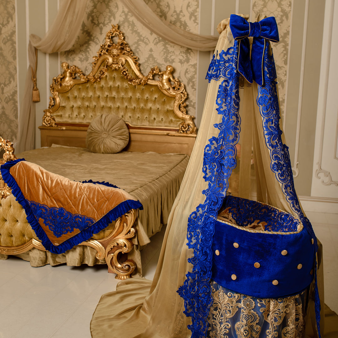 Decorative bed canopy with blue and gold accents in a bedroom setting.