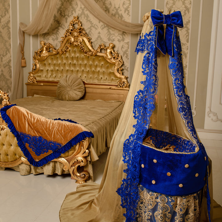 Decorative bed canopy with blue and gold accents in a bedroom setting.