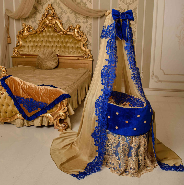 Decorative bed canopy with blue and gold accents in a bedroom setting.